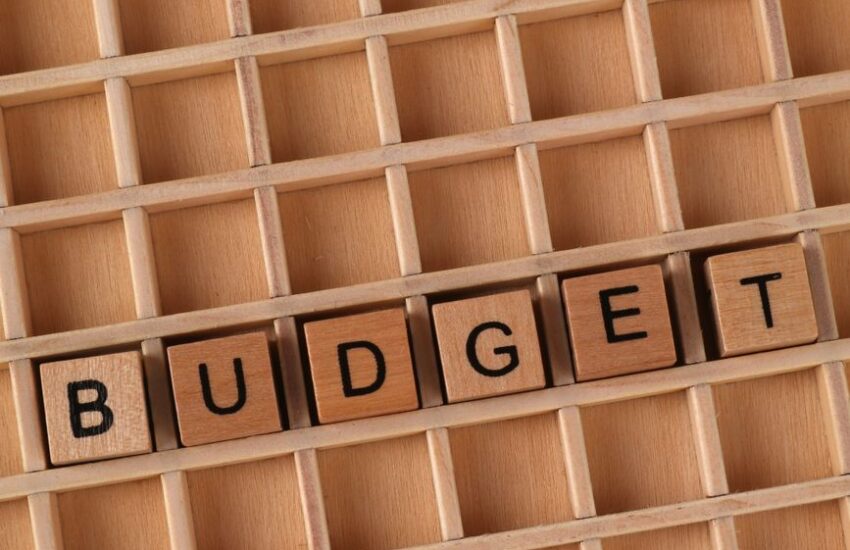wooden blocks spell out budget on grid