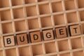 wooden blocks spell out budget on grid